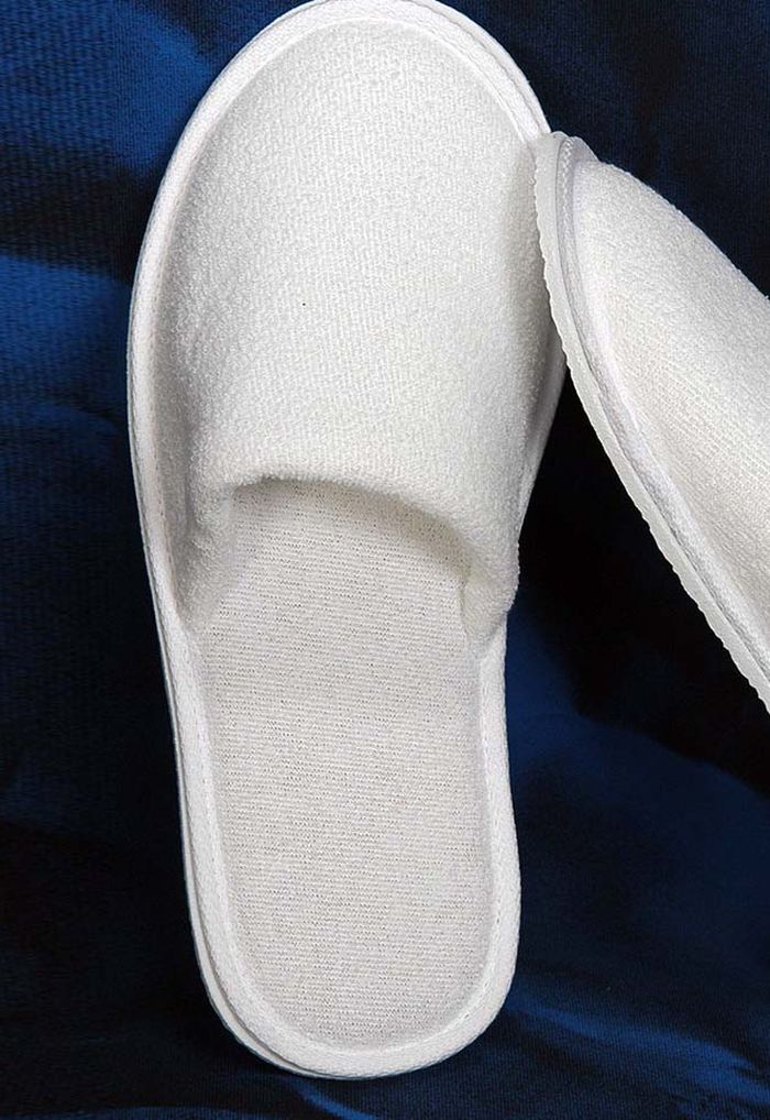 Hotel slipper with an illustrated logo placement area